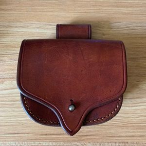 Genuine leather belt pouch. Color is reddish-brown. Belt not included.